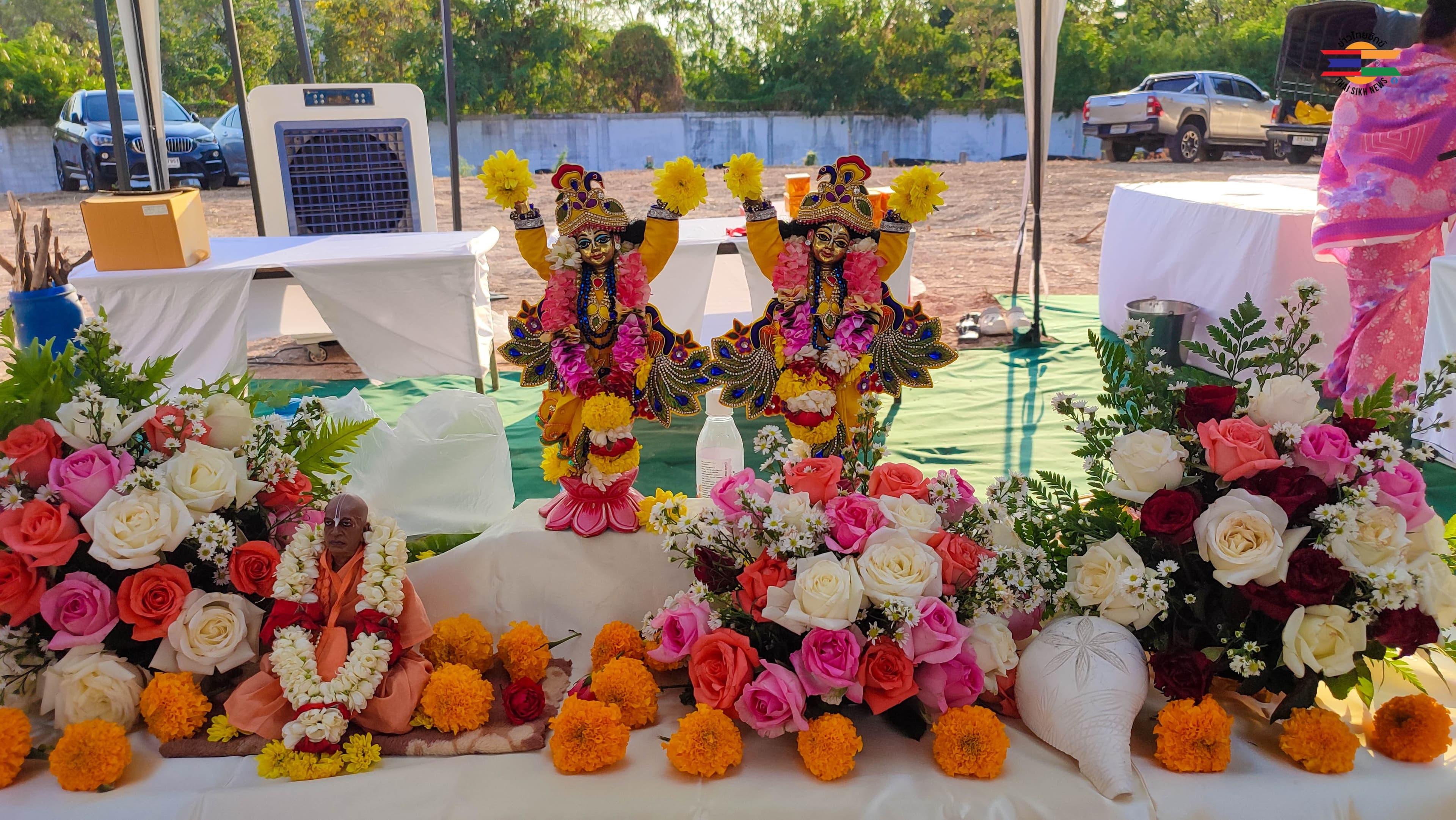 Devotional ceremony with flowers and offerings