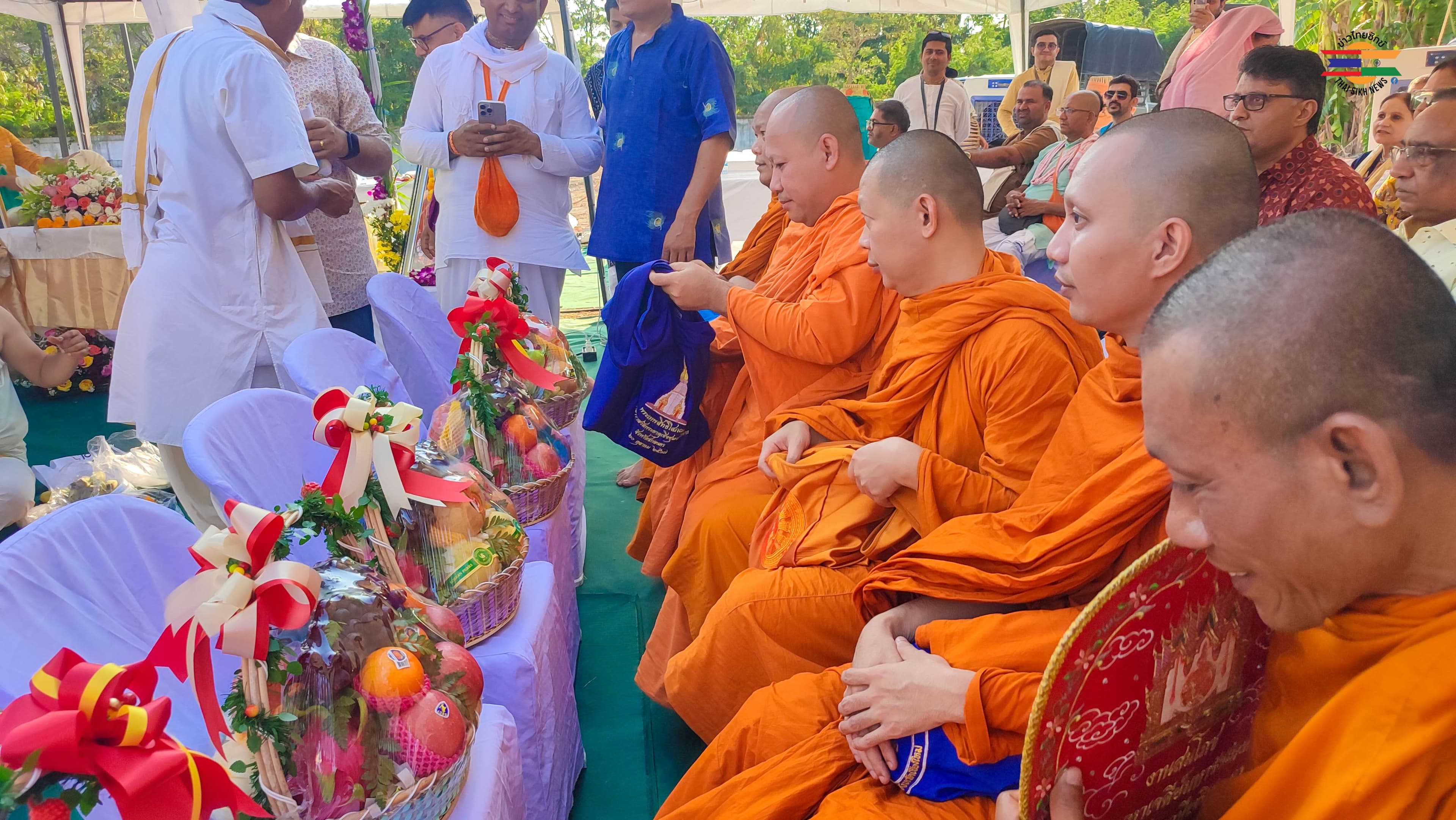 Monks in traditional orange robes at ceremony